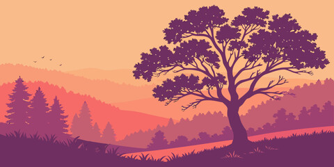 A solitary tree stands tall against the backdrop of a vibrant sunset over a mountainous landscape. © Rabbi