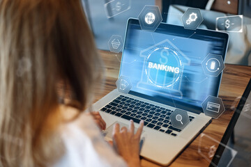 User makes a banking transaction using a laptop with online payment options displayed