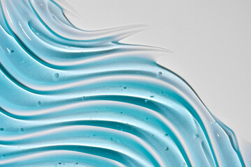 Liquid gel abstract cosmetic wavy background. Smear of transparent moisturizing product