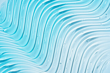 Close-up image displaying blue pure gel texture with glossy highlights and clear droplets, ideal...