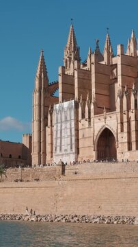 Palma Cathedral and the Royal Palace of Almudaina in Majorca, Spain. Sunny day view of these historic architectural landmarks.