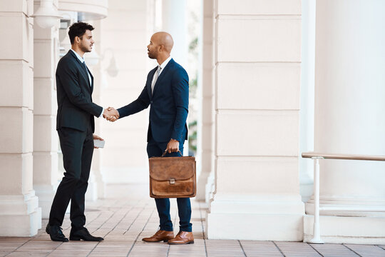 Business people, meeting or handshake with deal in city for hiring, agreement or proposal. Businessmen, employees or colleagues shaking hands with b2b for onboarding partnership or recruiting process