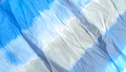 Crinkled paper with blue and grey painted stripes