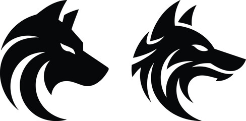 Two black wolf heads facing each other in profile Vector © Raton