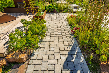 Modern covered terrace with assorted plants, beautiful patio on sunny day