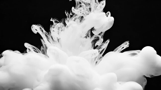 White ink dissolves and swirls in dark water. Ethereal cloud patterns expand slowly. Abstract milky fluid texture background.