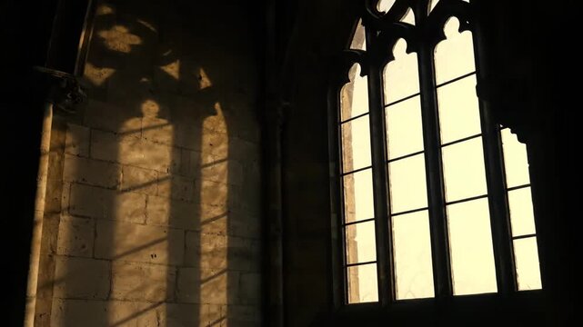 Time-lapse of sunlight illuminating a historic church interior, creating dynamic patterns on the textured wall.