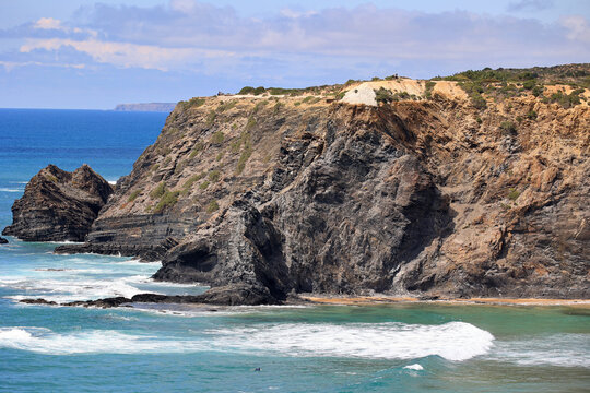 View of the steep cliffs at Odeceixe beach, Algarve, Portugal