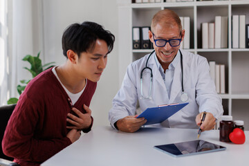 Fototapeta premium Male patient listening to a doctor in hospital.Medical care, Empathy, Consoling patient 