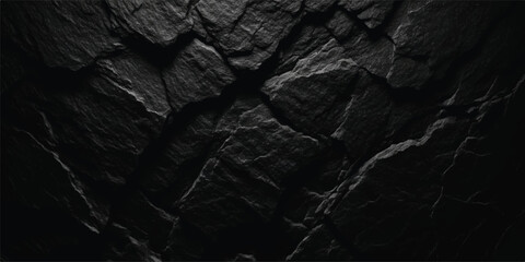 Fototapeta premium Dramatic dark slate rock texture with sharp, fractured edges and deep shadows, natural stone background
