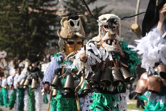 Zemen, Bulgaria - March 15, 2025: Masquerade festival Surva in Zemen, Bulgaria. People with mask called Kukeri dance and perform to scare the evil spirits.