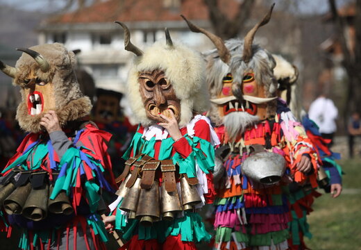 Zemen, Bulgaria - March 15, 2025: Masquerade festival Surva in Zemen, Bulgaria. People with mask called Kukeri dance and perform to scare the evil spirits.