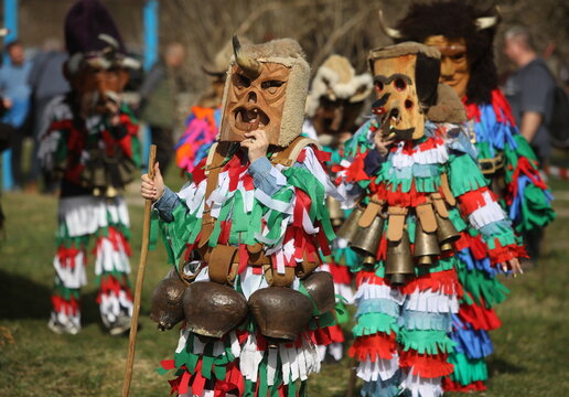 Zemen, Bulgaria - March 15, 2025: Masquerade festival Surva in Zemen, Bulgaria. People with mask called Kukeri dance and perform to scare the evil spirits.