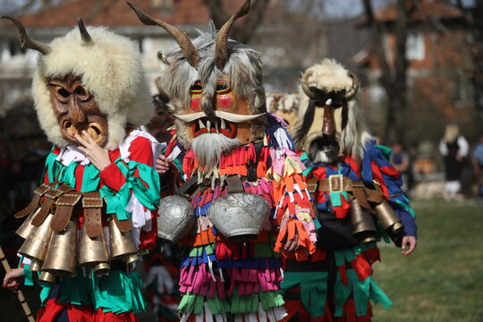 Zemen, Bulgaria - March 15, 2025: Masquerade festival Surva in Zemen, Bulgaria. People with mask called Kukeri dance and perform to scare the evil spirits.
