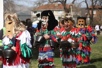 Zemen, Bulgaria - March 15, 2025: Masquerade festival Surva in Zemen, Bulgaria. People with mask called Kukeri dance and perform to scare the evil spirits.