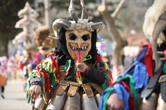 Zemen, Bulgaria - March 15, 2025: Masquerade festival Surva in Zemen, Bulgaria. People with mask called Kukeri dance and perform to scare the evil spirits.
