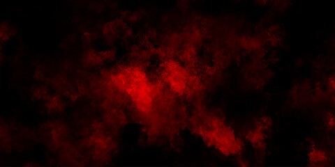 Fototapeta premium Abstract grunge red and black powder explosion cloud on black background. dark red smoke Like cloud wave effect on black. dark fire flame grunge texture background. toned fiery red sky.