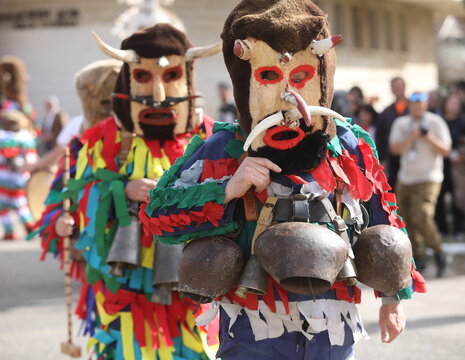 Zemen, Bulgaria - March 15, 2025: Masquerade festival Surva in Zemen, Bulgaria. People with mask called Kukeri dance and perform to scare the evil spirits.