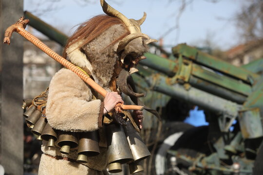 Zemen, Bulgaria - March 15, 2025: Masquerade festival Surva in Zemen, Bulgaria. People with mask called Kukeri dance and perform to scare the evil spirits.