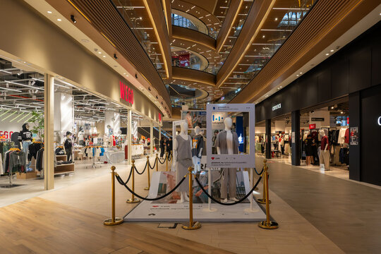 Kuala Lumpur, Malaysia - February 19, 2026: Various interior scenes of the modern LaLaport Bukit Bintang City Centre (BBCC) shopping mall, featuring retail clothing stores, shoe displays, and etc.