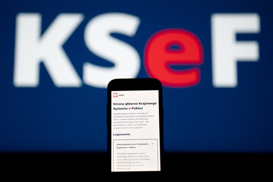 KSeF Krajowy System e-Faktur website on a smartphone screen, logo in bg. Government e-Invoicing tax platform for issuing, receiving, storing structured invoices on February 17, 2026 in Krakow, Poland.
