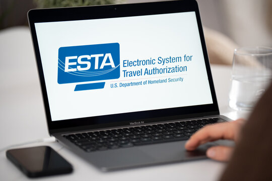 ESTA Electronic System for Travel Authorization logo sign on a laptop screen. Verifies eligibility to travel to the United States under the Visa Waiver Program on February 17, 2026 in Krakow, Poland.