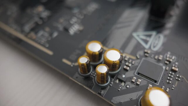 Sarajevo, Bosnia and Herzegovina &ndash; February 15, 2026 &ndash; Macro closeup of motherboard PCB showing capacitors, resistors, vrm components and integrated circuits
