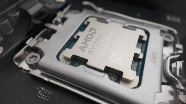 Sarajevo, Bosnia and Herzegovina &ndash; February 15, 2026 &ndash; Slow motion wider shot of Ryzen 9950X3D processor installed in AM5 socket on MSI X870E motherboard