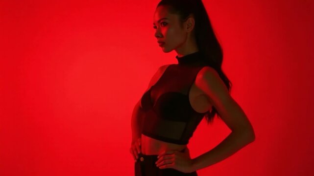 A woman wearing a black top and pants, no other details