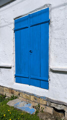 beautiful wooden blue door on the white traditional house in Vojvodina province