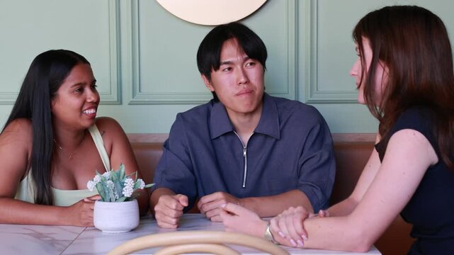 International University Students Chatting at a Cafe