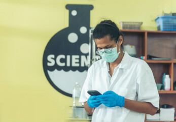 Fototapeta premium Scientist man holding chemical test glass tube testing science laboratory. Doctor clinic healthcare lab technician diagnosis sample. Asian man scientist working vaccine test medical biochemistry lab
