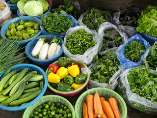 Fresh vegetables and herbs at local market in Vietnam © Evi