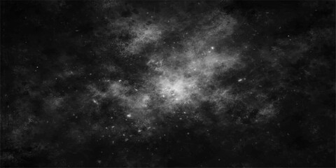 A dark black and white space background features a dramatic explosion of smoke and stardust textured with ethereal clouds and faint moonlight © hossain