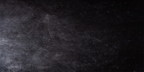 A dark grunge texture captures a black hole in the snow and water against a black and white space background with vintage smoke patterns and grey chalk board wallpaper © hossain