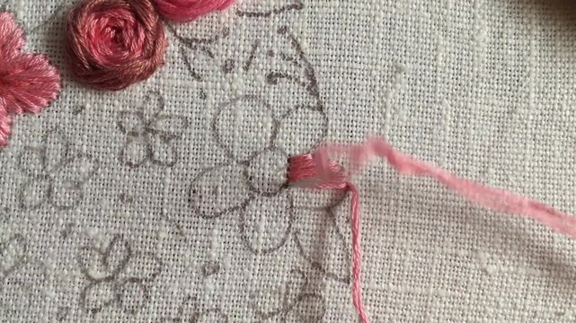 Satin stitch flower embroidery tutorial. Close-up hand stitching colorful floral element on fabric. Step-by-step needlework technique for beginners, DIY craft learning. part 2