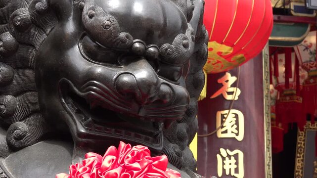 Dragon statue and traditional Chinese characters at Wong Tai Sin temple in Hong Kong
