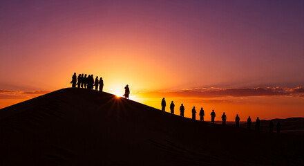 Silhouette of people in robe walking on sand dune at sunrise. It represents journey, exploration, and spirituality in a desert landscape