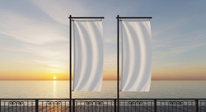 Serene sunset scene with two white flags by the calm sea