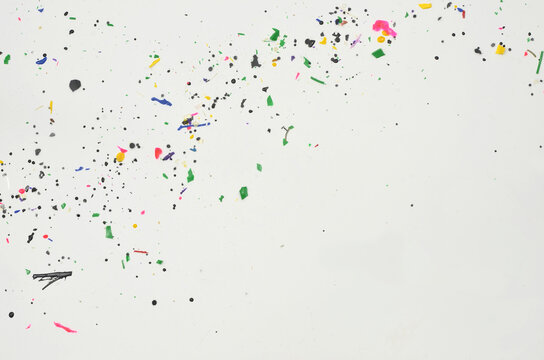 Colorful pieces of plastic, microplastics on white background and empty space to fill with content. Illustration of very dangerous waste generated by humans that does not decompose.