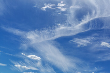 Deep blue sky with beautiful cumulus clouds.