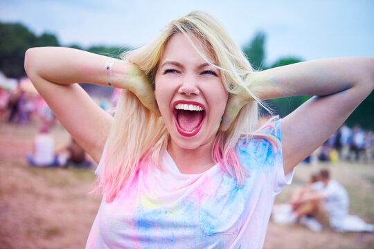 Hipster woman singing during music festival