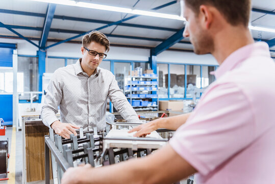 Employees in shop floor checking product quality