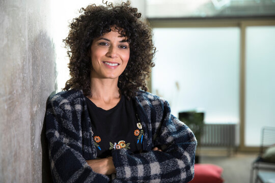 Portrait of smiling woman in a loft