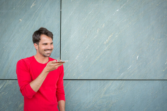 Man leaving a voicemail with his smartphone