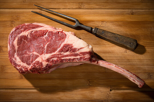 Raw tomahawk steak