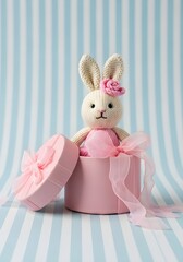 Cute Knitted Bunny Toy Peeking Out Of Pink Gift Box With Ribbon On Pastel Background