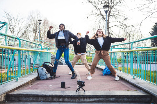 Young dancers rehearsing in a skate park, making a video