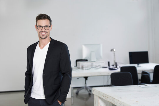 Portrait of a young businessman in his office