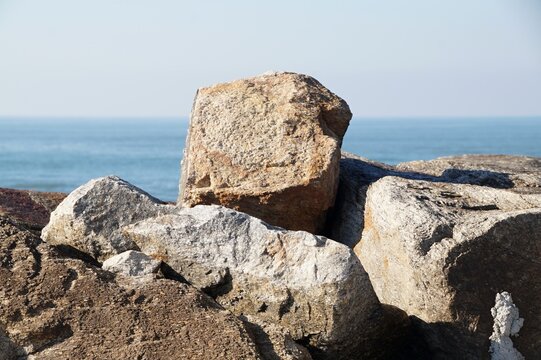 Coastal rocks overlooking the ocean horizon on a sunny day, Esmoriz - Portugal